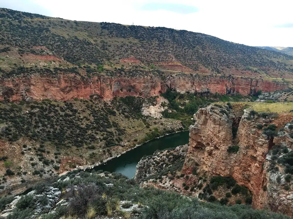 Red rock walls of Bighorn Canyon above the Bighorn River