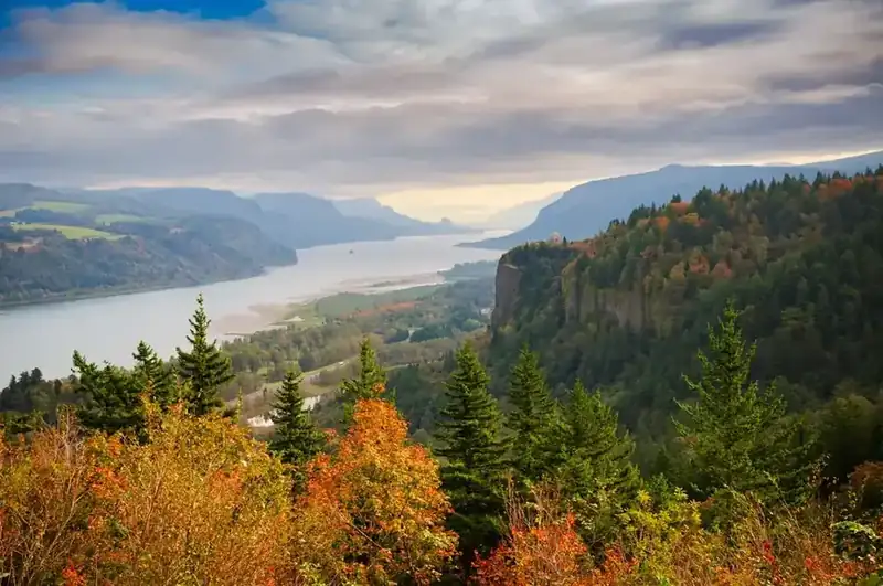 The Columbia River Gorge in autumn, with Vista House on Crown Point above the river