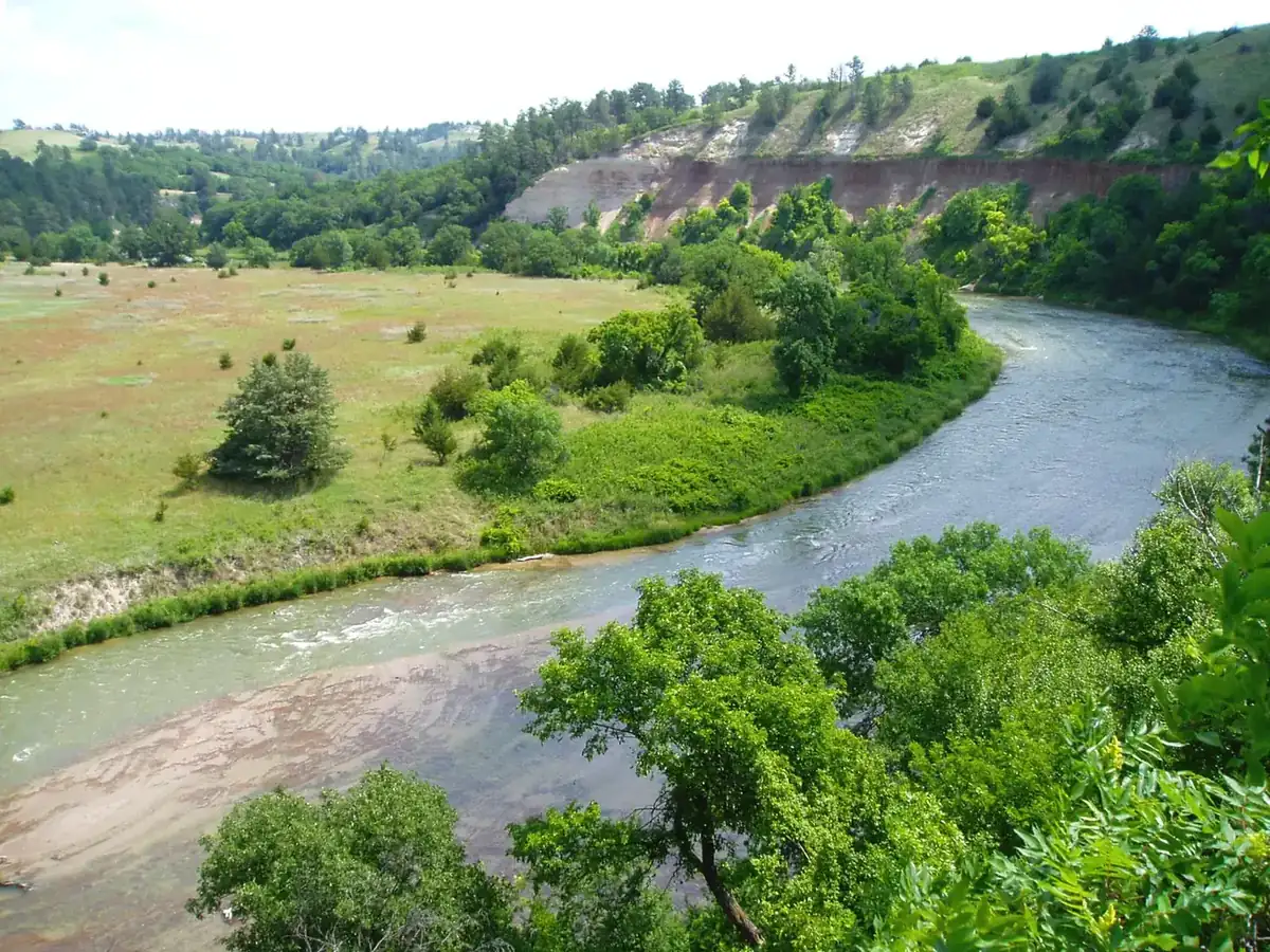 The Niobrara River winding between wooded bluffs, from the Fort Falls Overlook